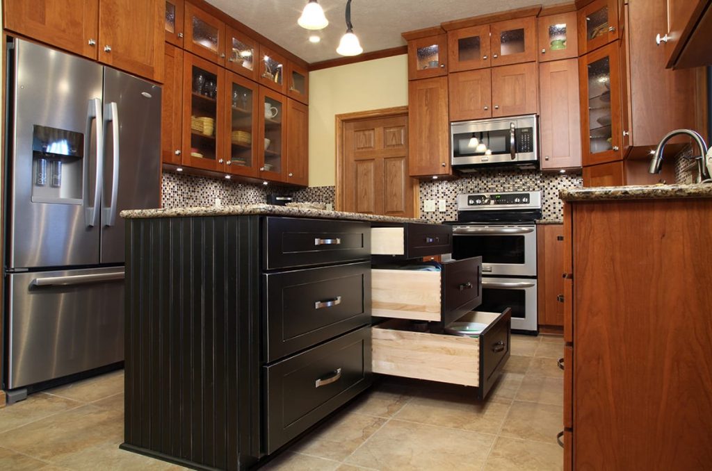 Contemporary kitchen with kitchen island featuring drawer bank with deep drawers for storage