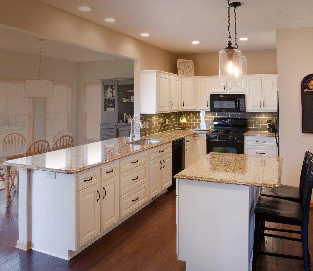 New countertops atop white kitchen cabinets