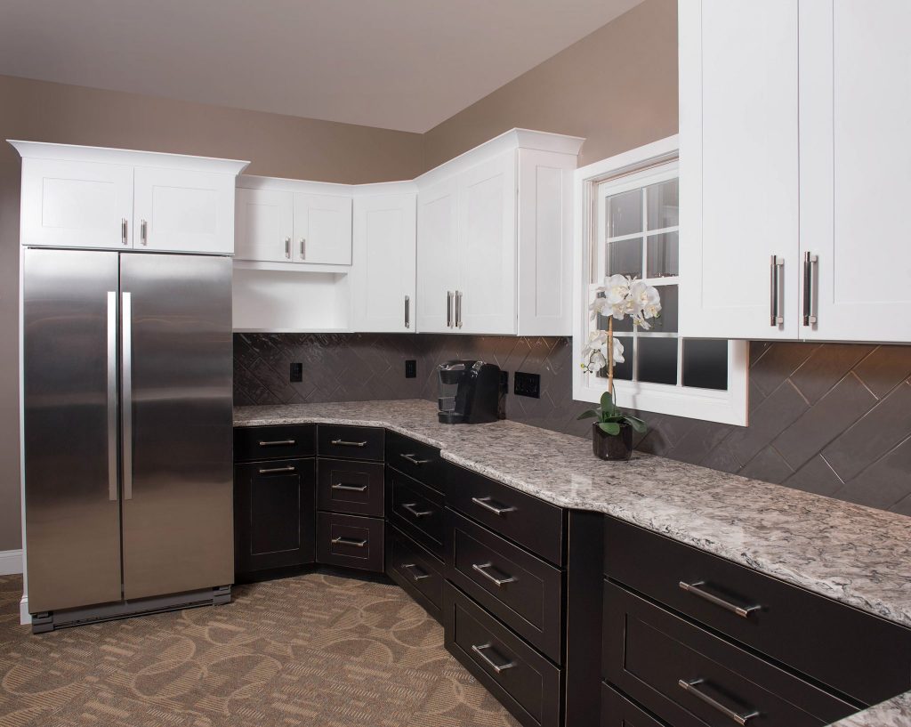 A fresh countertop complements newly-refaced white cabinets