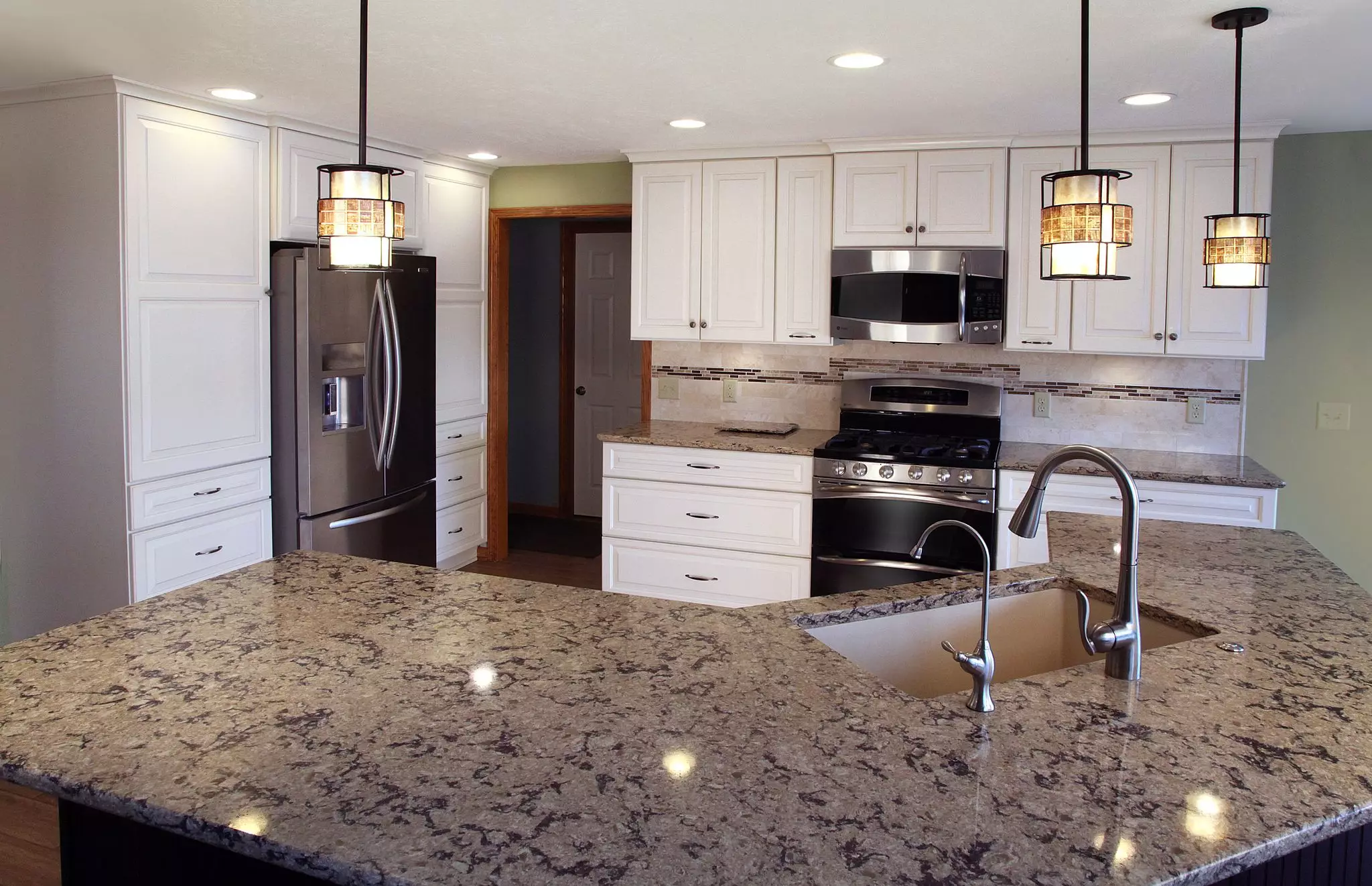 Transitional Kitchen Remodel with a Large Island and white cabinets