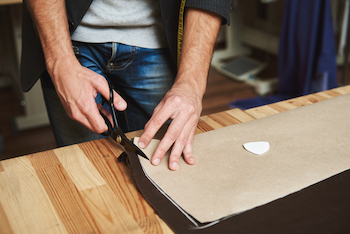 cabinet expert cutting wood veneer