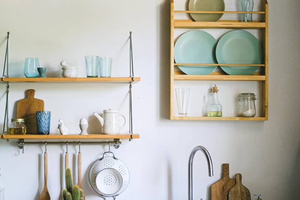 Kitchen Interior with Counter and Shelves with Utensils